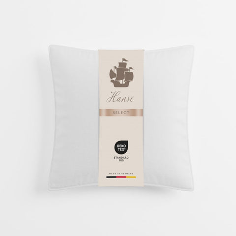 Quadratisches Select 3-Kammer-Kissen mit eleganter Produktverpackung und hochwertiger Präsentation auf neutralem Hintergrund.
